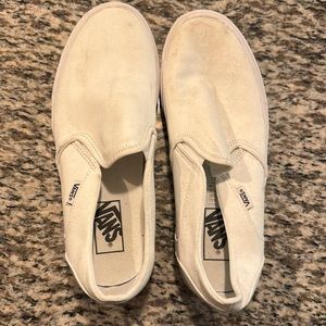All white slip on vans